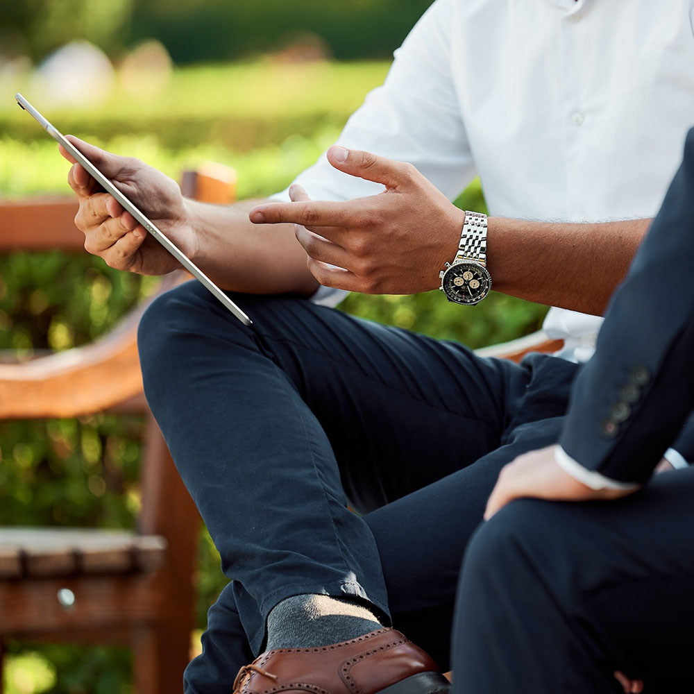 Two people using a tablet